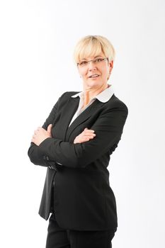Portrait of confident smiling mature businesswoman standing against white background
