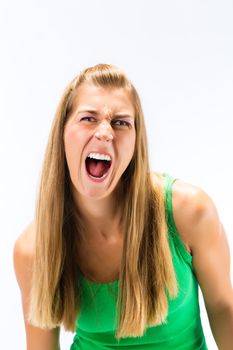 Portrait of blonde young woman screaming against white background