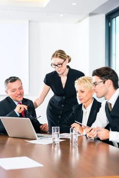 Businessman showing new business plans on laptop