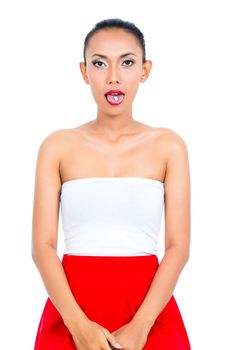 Young woman showing medicine in mouth on white background