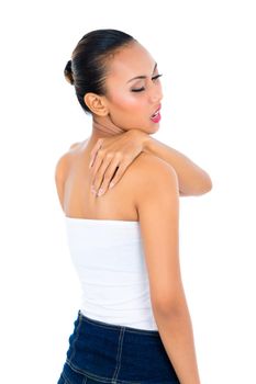 Woman in pain rubbing neck and shoulders on white background