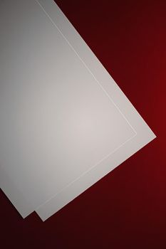 Blank A4 paper, white on red background as office stationery flatlay, luxury branding flat lay and brand identity design for mockup.