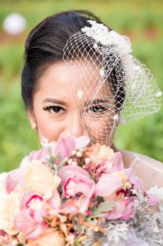 Happy Indonesian bride on her wedding