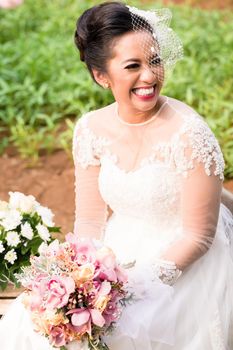 Happy Indonesian bride on her wedding