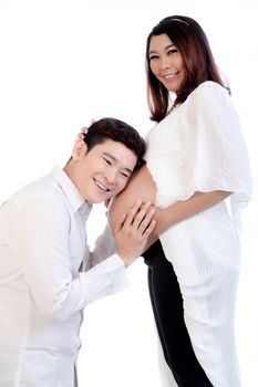 Smiling man listening to his wife's belly isolated over white background