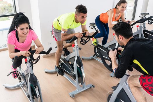 High angle view of a people exercising on bicycle in gym
