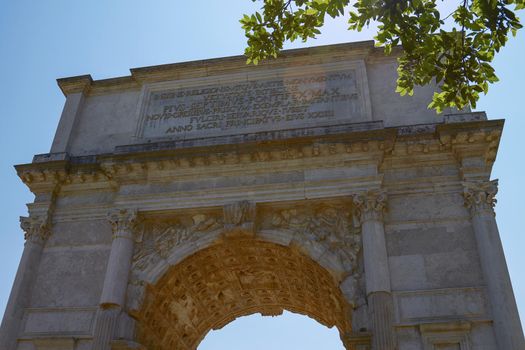 The Triumphal Arch of Titus (Arco di Tito) is a 1st-century honorific arch, located on the Via Sacra, just to the south-east of the Roman Forum, Rome. "Spoils of Jerusalem" relief on the inside arch.