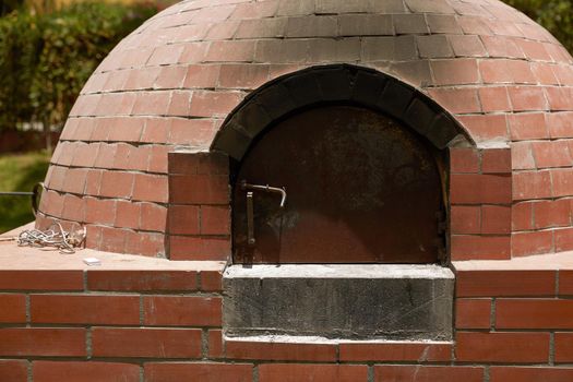 Close Up of Small Rural  DIY Brick Smokehouse Ready for BBQ.