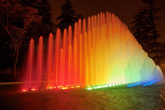 Beautiful colorful fountain at night in Park of the Reserve, Lima, Peru