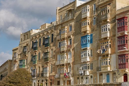 Typical and traditional colorful architecture and houses in Valletta in Malta.