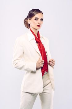 Elegant and expensive model wearing white business suit in studio shot