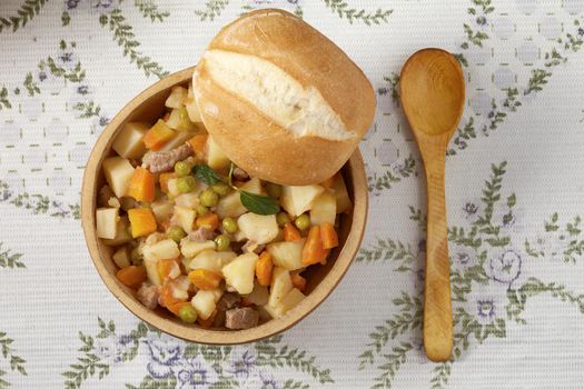 Topp view of traditional peruvian meal Matasquita and bread placed on a bowl