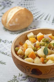 Close up view of traditional peruvian meal Matasquita with bread in background