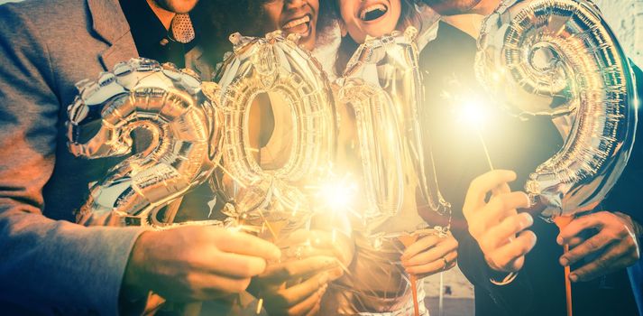 Group of party people celebrating the arrival of 2019, men and women looking into camera