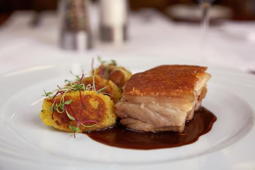 Traditional Peruvian Meal Called Chicharron de Panceta de Cerdo Served in a Restaurant.