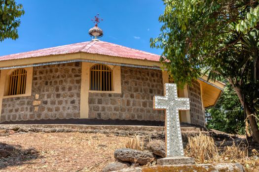 religious christian cross behind Entos Eyesu UNESCO Monastery situated on small island on lake Tana near Bahir Dar. Ethiopia Africa