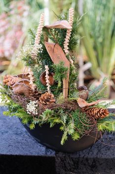 Grave decoration in autumn colors for sale in gardening shop