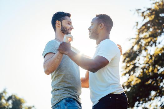 Two men dancing Kizomba outdoors