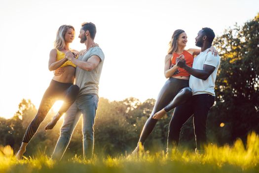 Professional dancers training outdoors in the park