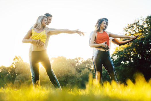 Professional dancers training outdoors in the park