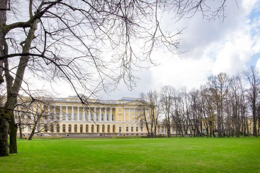 Saint Petersburg, Russia - May 2, 2021. The northern facade of the Mikhailovsky Palace, the building of the State Russian Museum in early spring. Mikhailovsky Garden. Selective focus.