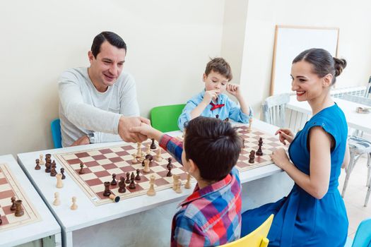 People in chess school learning the game