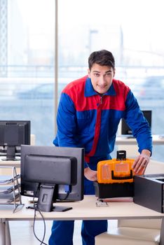 Computer repairman specialist repairing computer desktop