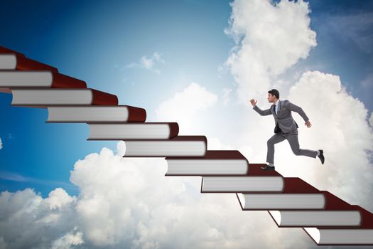 Businessman student climbing the ladder of education books