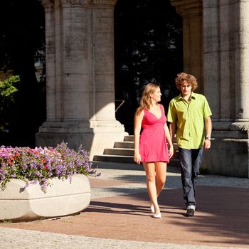 Man and woman in the city - walking on a summer day