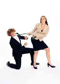 Business people - he is kneeling in front of her and she is pulling him on this tie