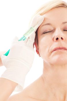 Botox - Age and beauty; a doctor is doing the injection