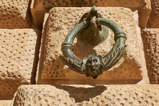 Decoration ring on the wall of Palacio de Carlos V in La Alhambra, Granada, Spain.