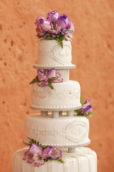 White wedding cake decorated with flowers