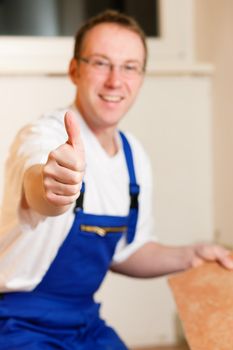 Friendly tiler on a construction site