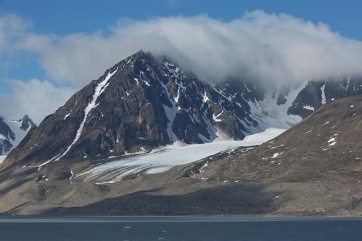 The coastline and mountains of Liefdefjord in the Svalbard Islands (Spitzbergen) in the high Arctic.