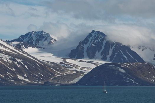 The coastline and mountains of Liefdefjord in the Svalbard Islands (Spitzbergen) in the high Arctic.