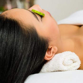 Young Asian Woman in a beauty spa getting a treatment for facial Skin Care