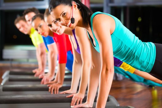 Gymnastic - Group of young people at stretching in gym