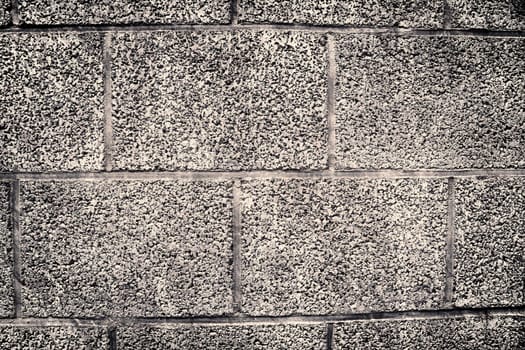 Aged and weathered old brick wall texture in a vintage retro design 