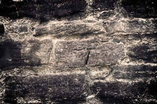 Aged and weathered old brick wall texture in a vintage retro design 