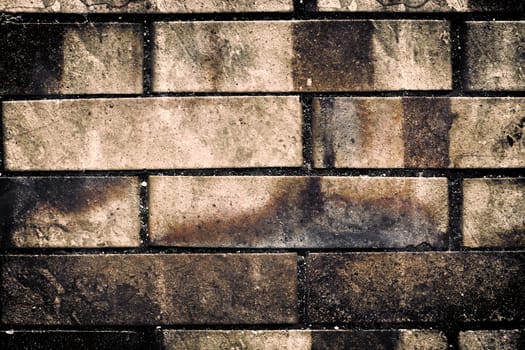 Aged and weathered old brick wall texture in a vintage retro design 