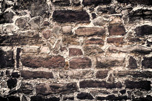 Aged and weathered old brick wall texture in a vintage retro design 