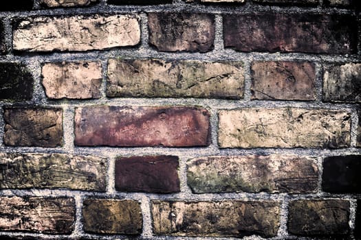 Aged and weathered old brick wall texture in a vintage retro design 