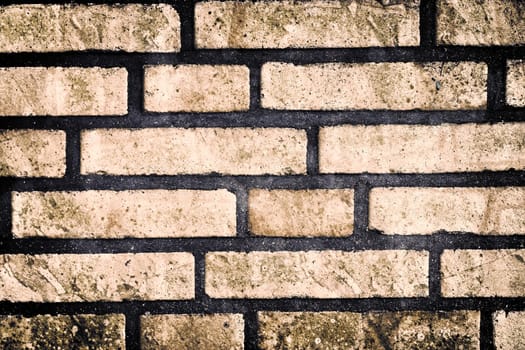 Aged and weathered old brick wall texture in a vintage retro design 