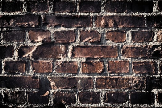 Aged and weathered old brick wall texture in a vintage retro design 