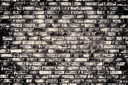 Aged and weathered old brick wall texture in a vintage retro design 