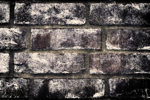 Aged and weathered old brick wall texture in a vintage retro design 