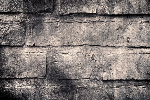 Aged and weathered old brick wall texture in a vintage retro design 