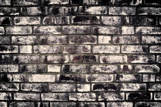 Aged and weathered old brick wall texture in a vintage retro design 