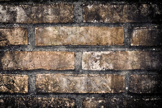 Aged and weathered old brick wall texture in a vintage retro design 